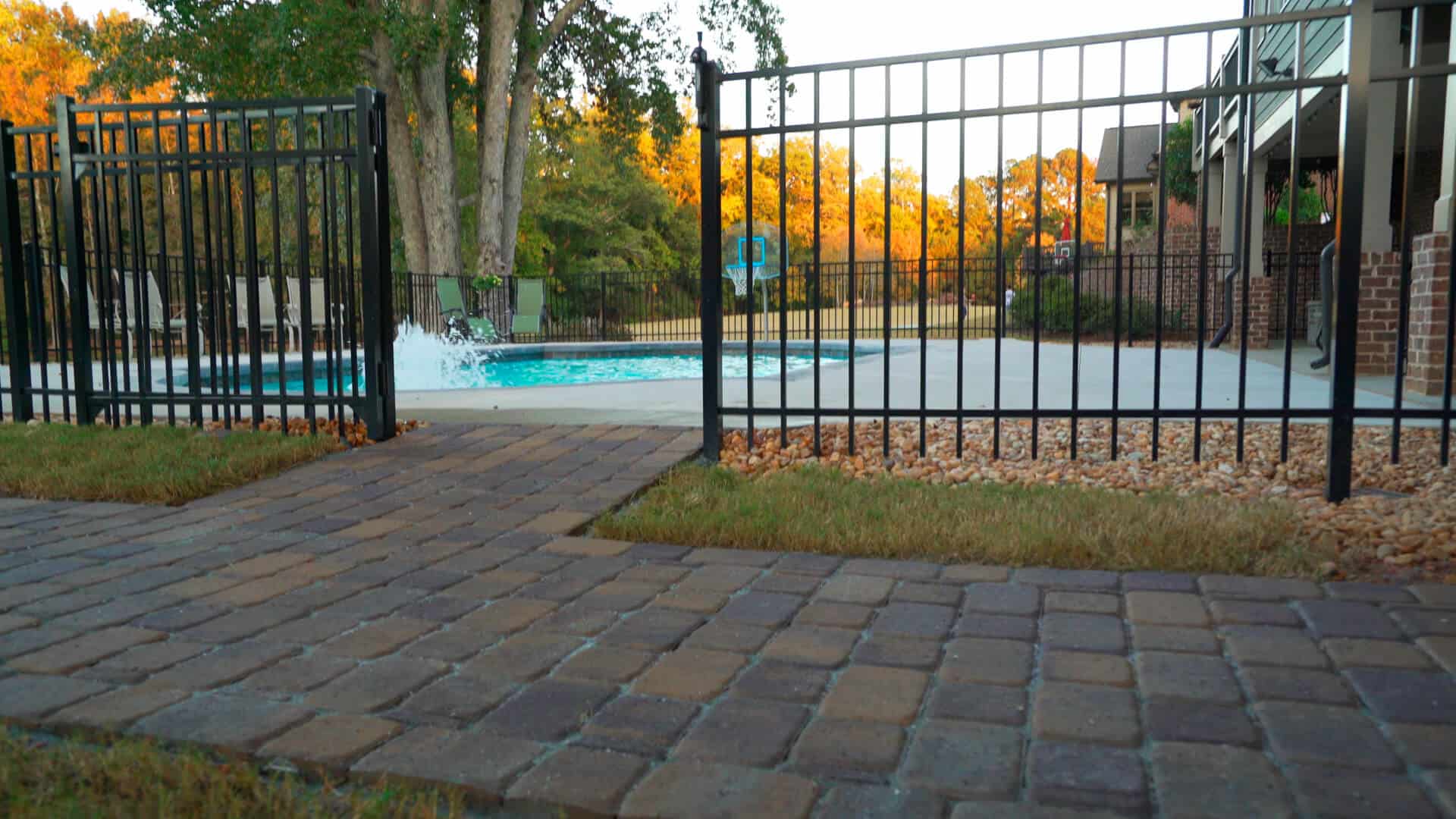Paver walkway to a pool is a simple DIY project to connect your backyard spaces.