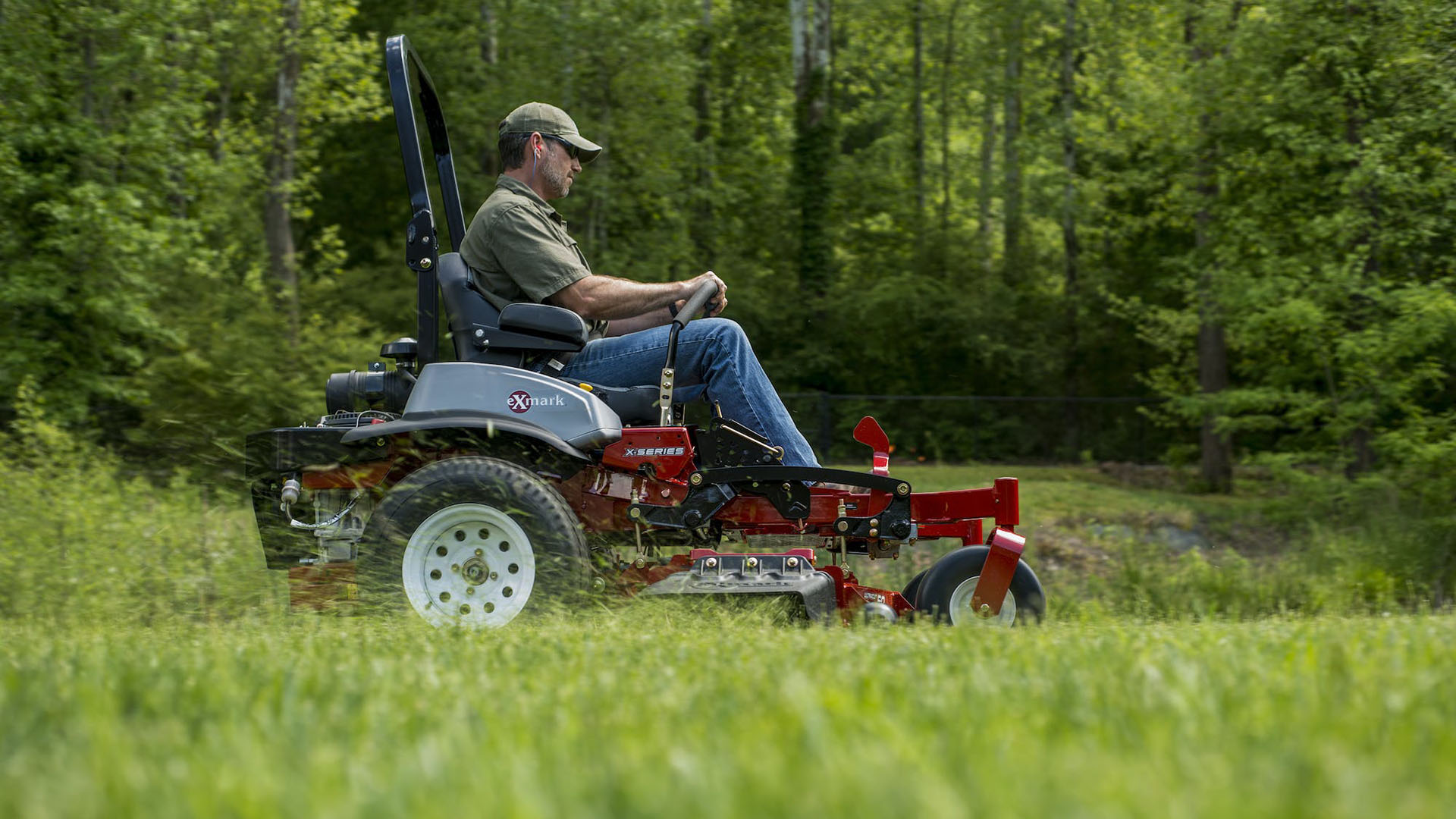 Man mowing grass on Exmark mower