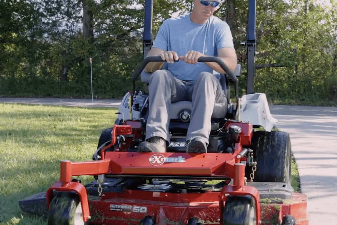 Andy Morgan mowing lawn