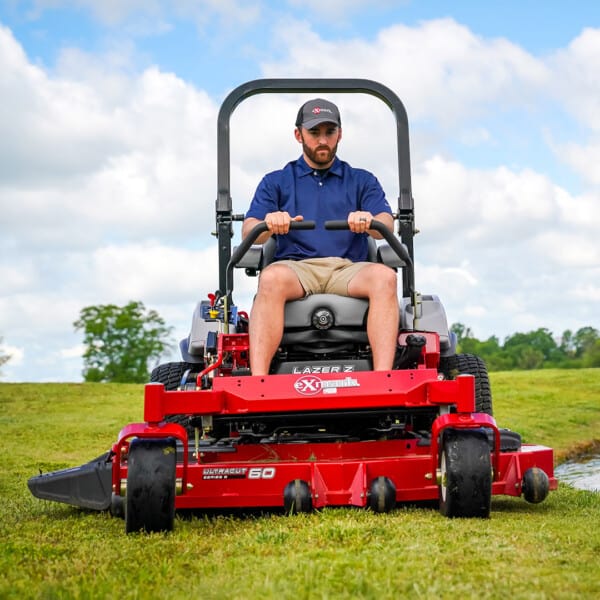 Austin Dillon on mower in field