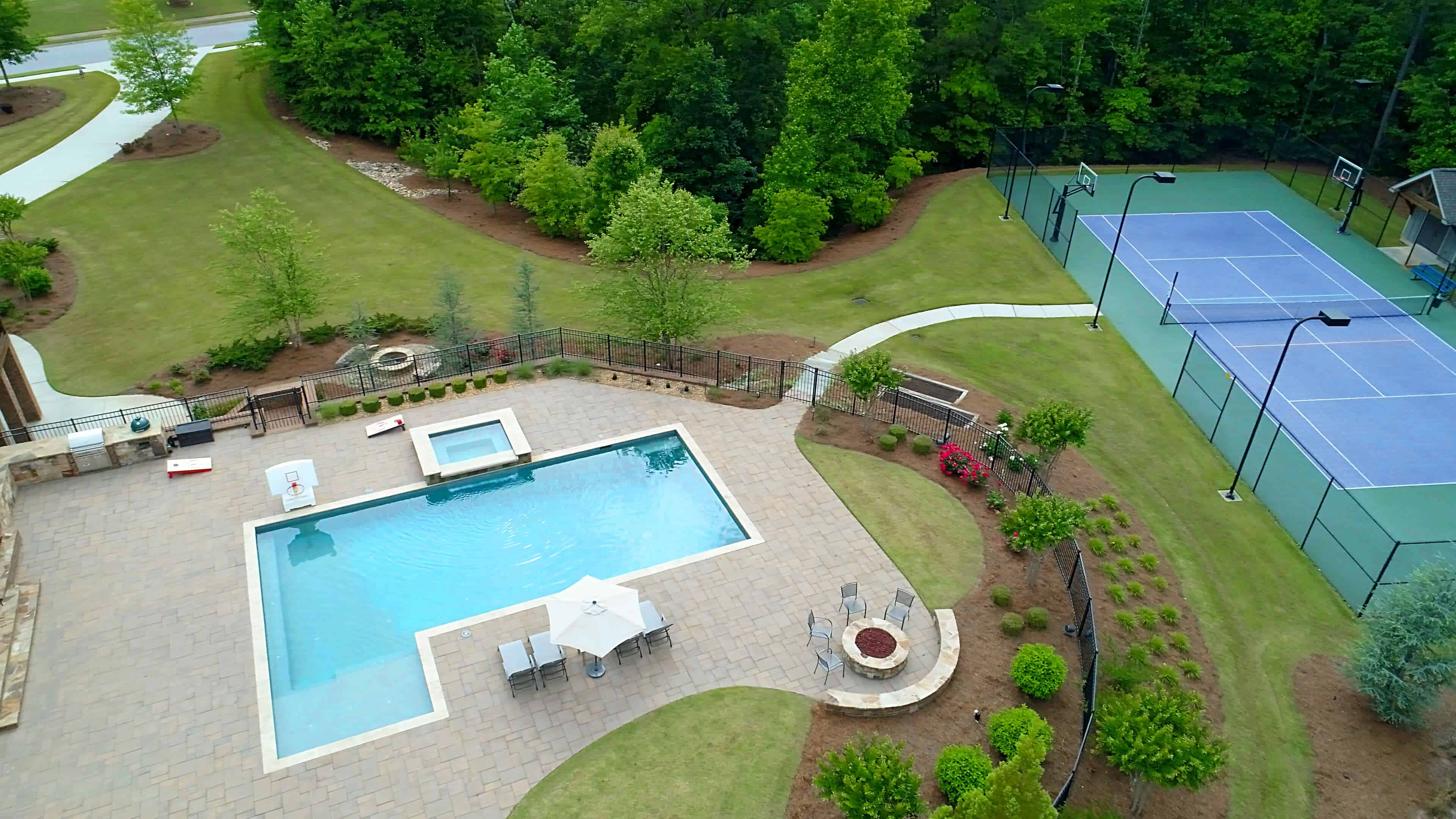 Swimming pool backyard with tennis court