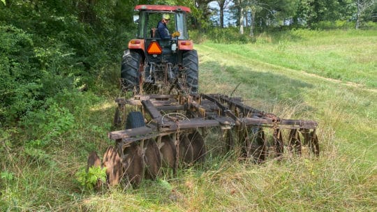 Tractor tilling property