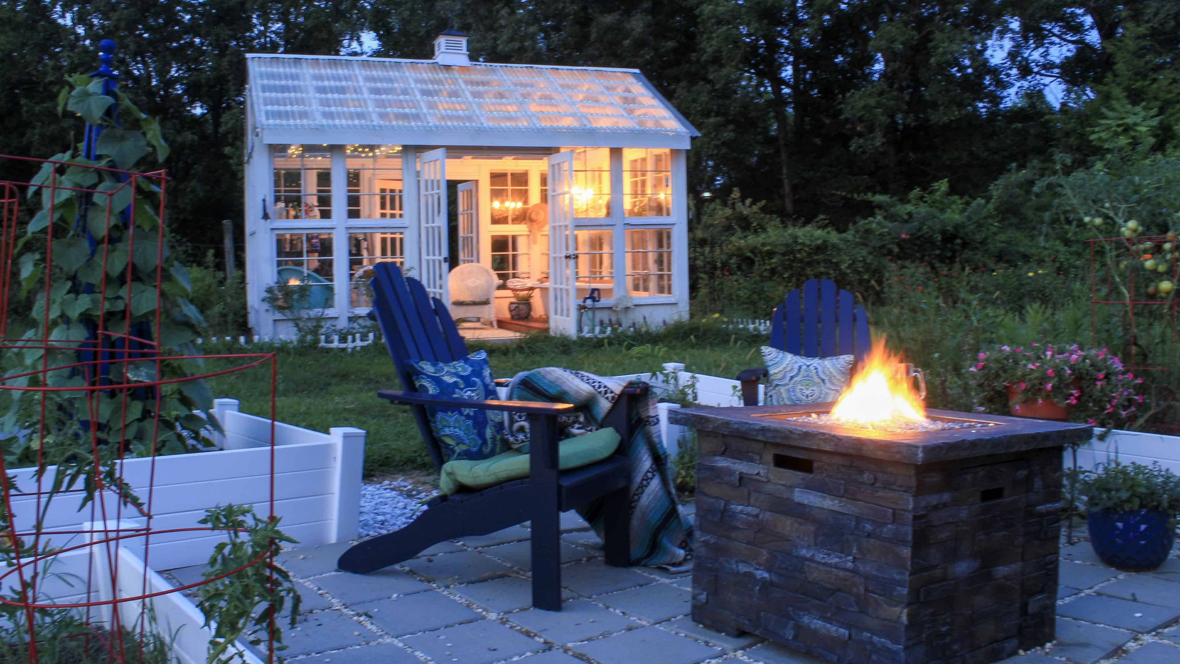 Backyard fire pit with greenhouse