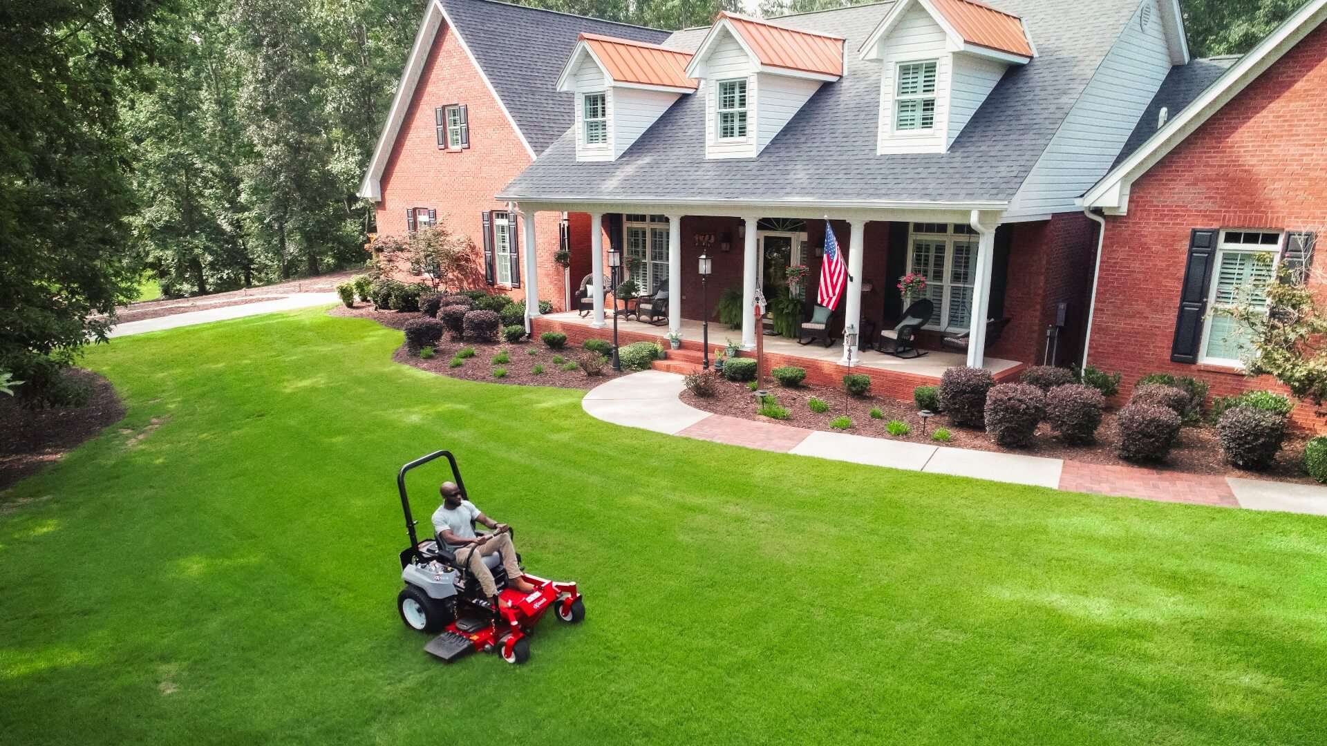 Man using Exmark mower to get a professional look