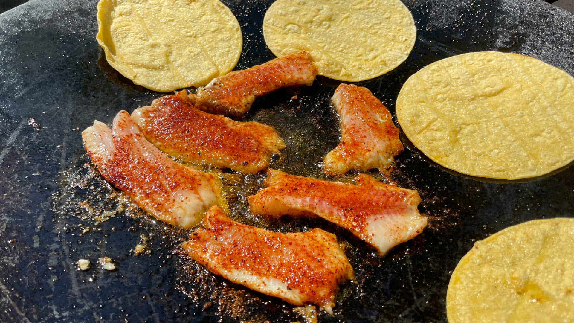 Cook white bass on high heat in a wok