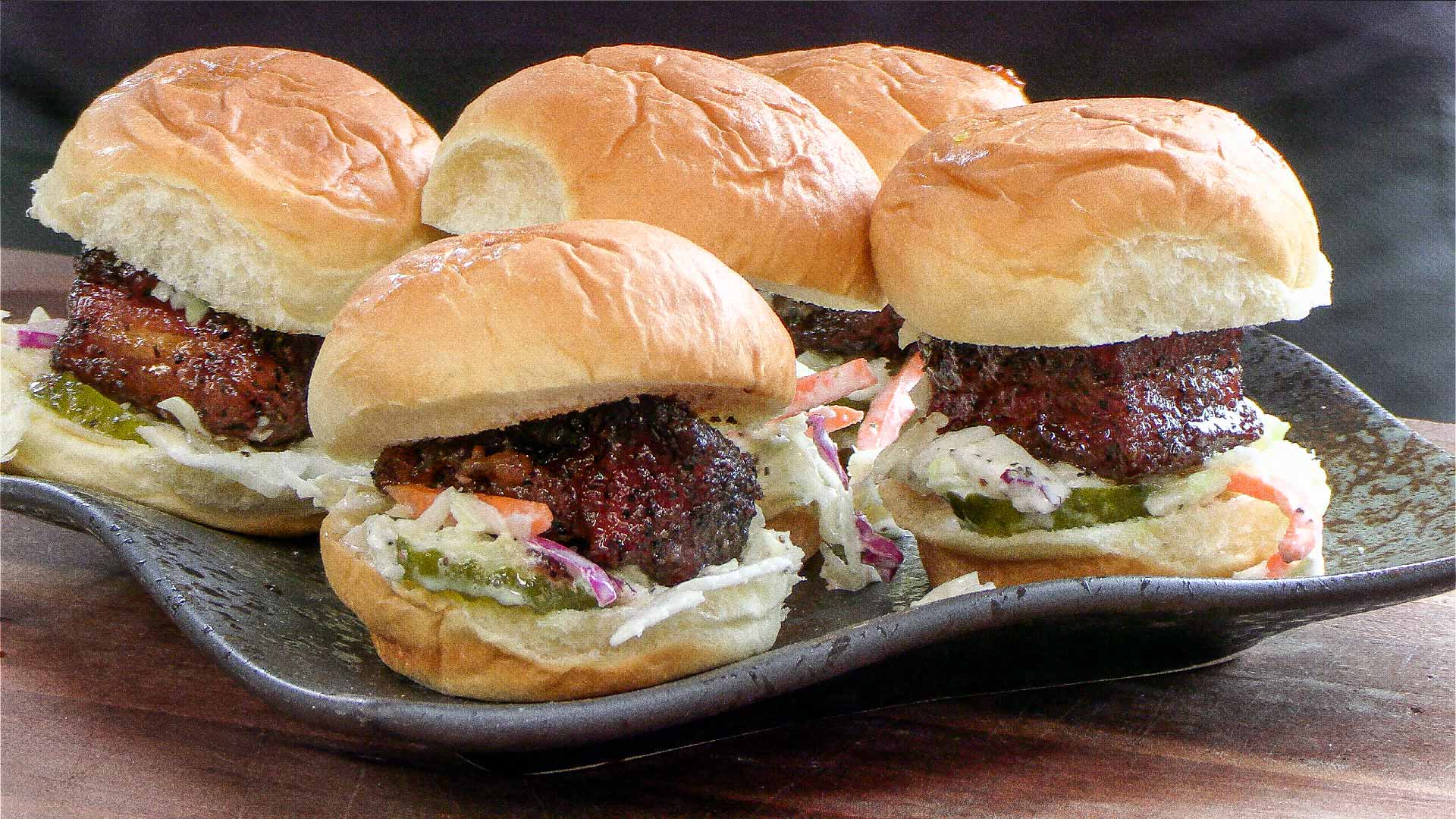 Sweet savory pork belly sliders with a touch of heat.