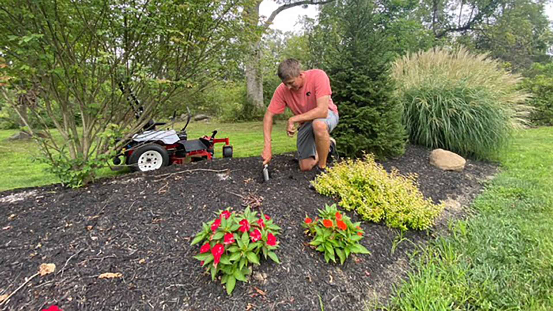 Grae Buck planting fall bulbs in his yard.