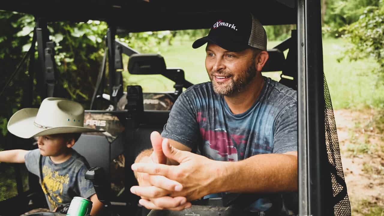Mike Waddell and son in ATV