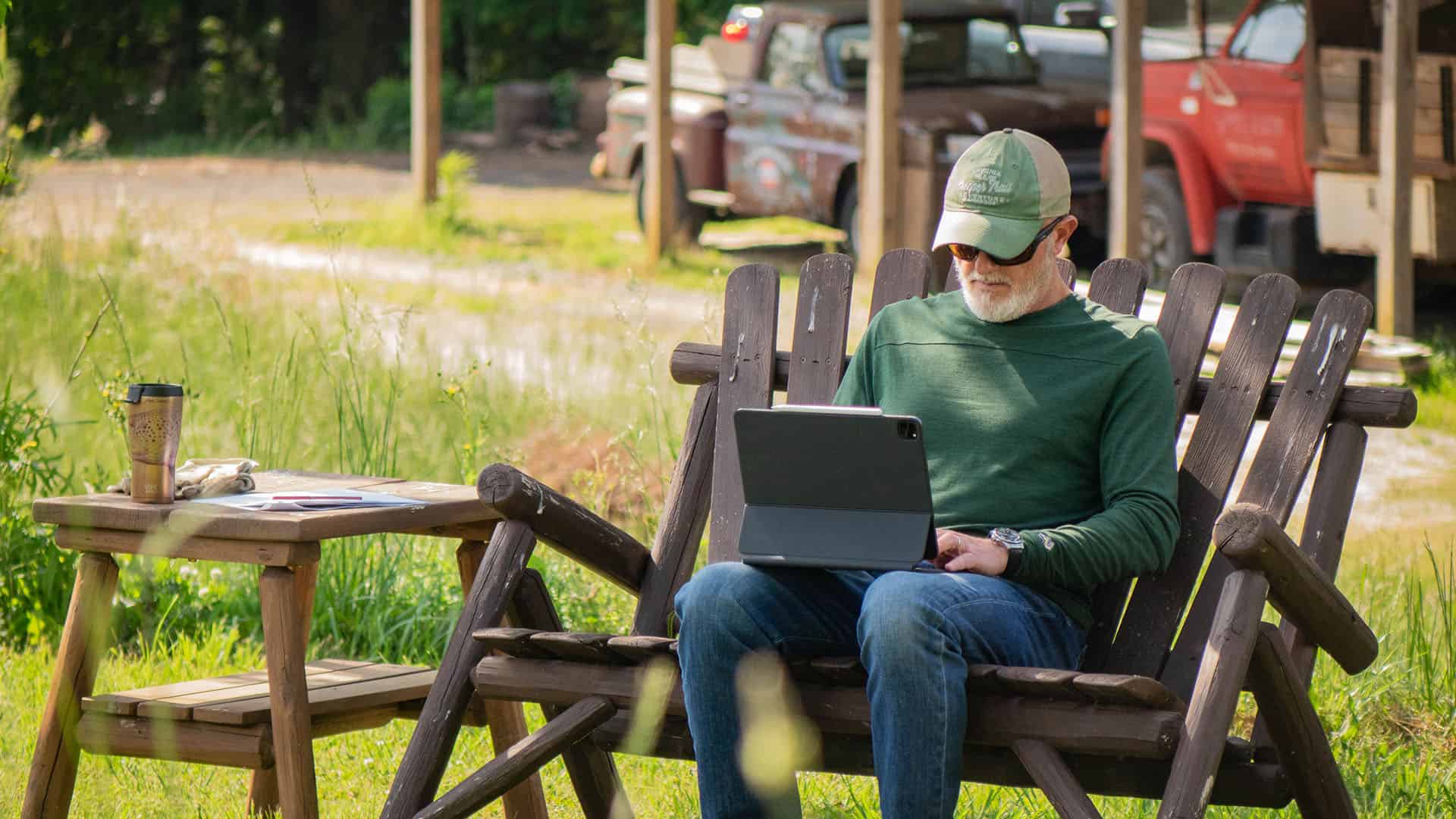 Man sitting outside on a computer