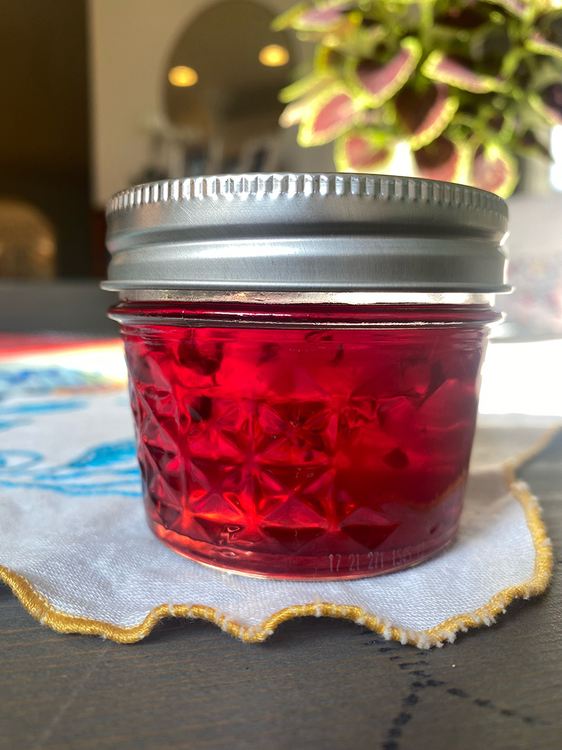 Plum jam in a mason jar