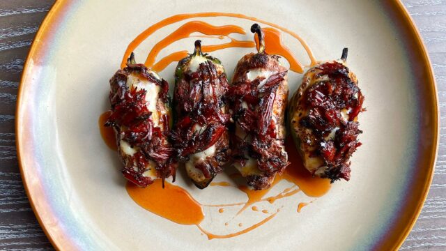 David Bancroft's jalapeno brisker poppers on plate with hot honey drizzle